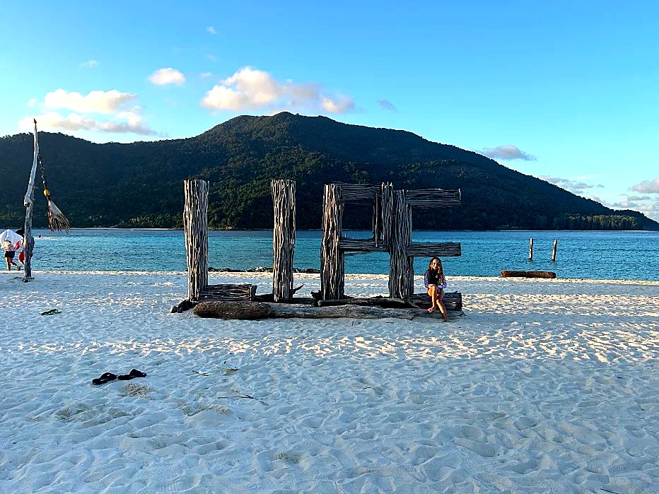 Koh Lipe sign with Koh Adang in the background