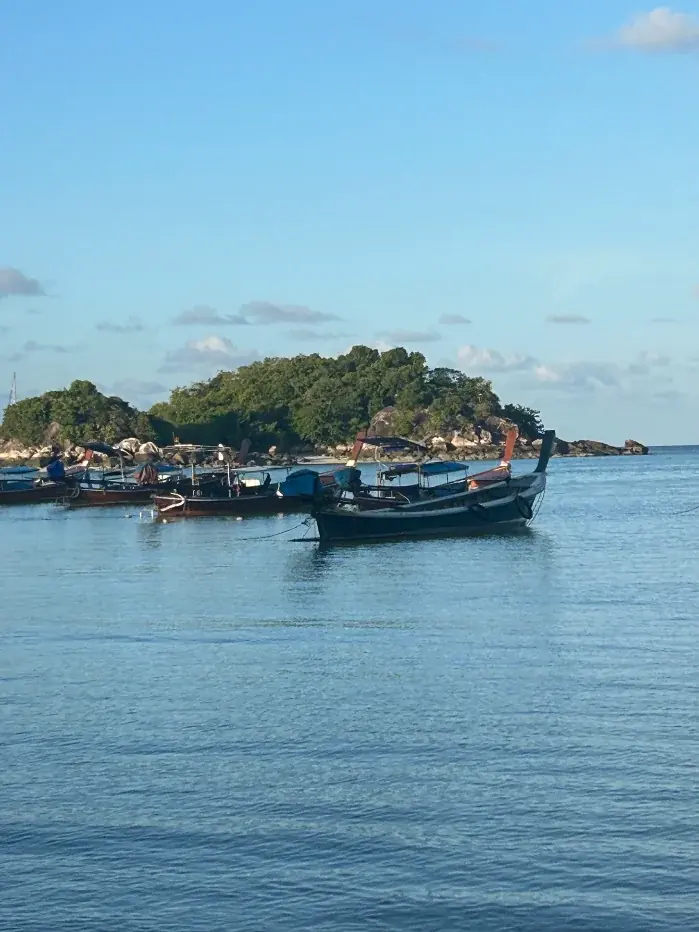 Longtail boats off Koh Lipe — the workhorses of every island-hopping day