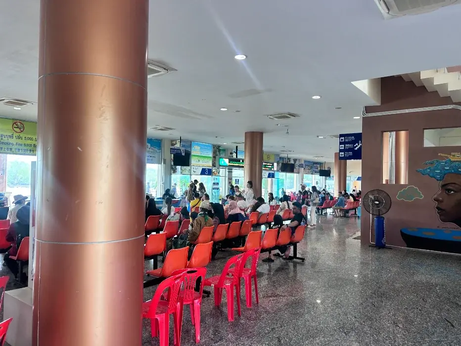 Inside the Pak Bara pier departure lounge — your last waiting room before the speedboat